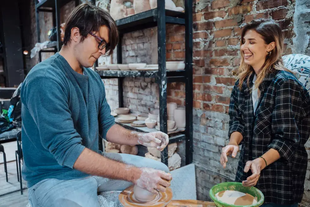 Students learning ceramics on pottery wheels